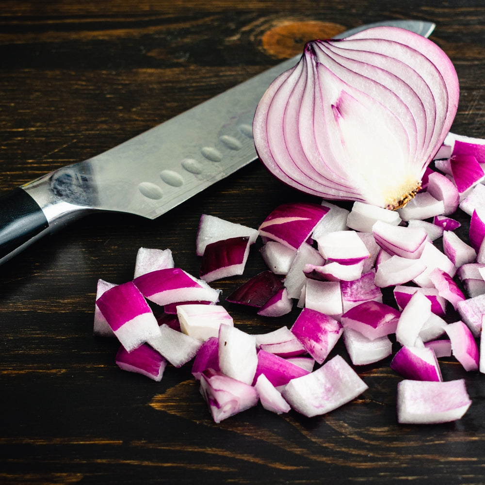 This Kitchen Tool Is My Secret Weapon for Cutting Onions Without